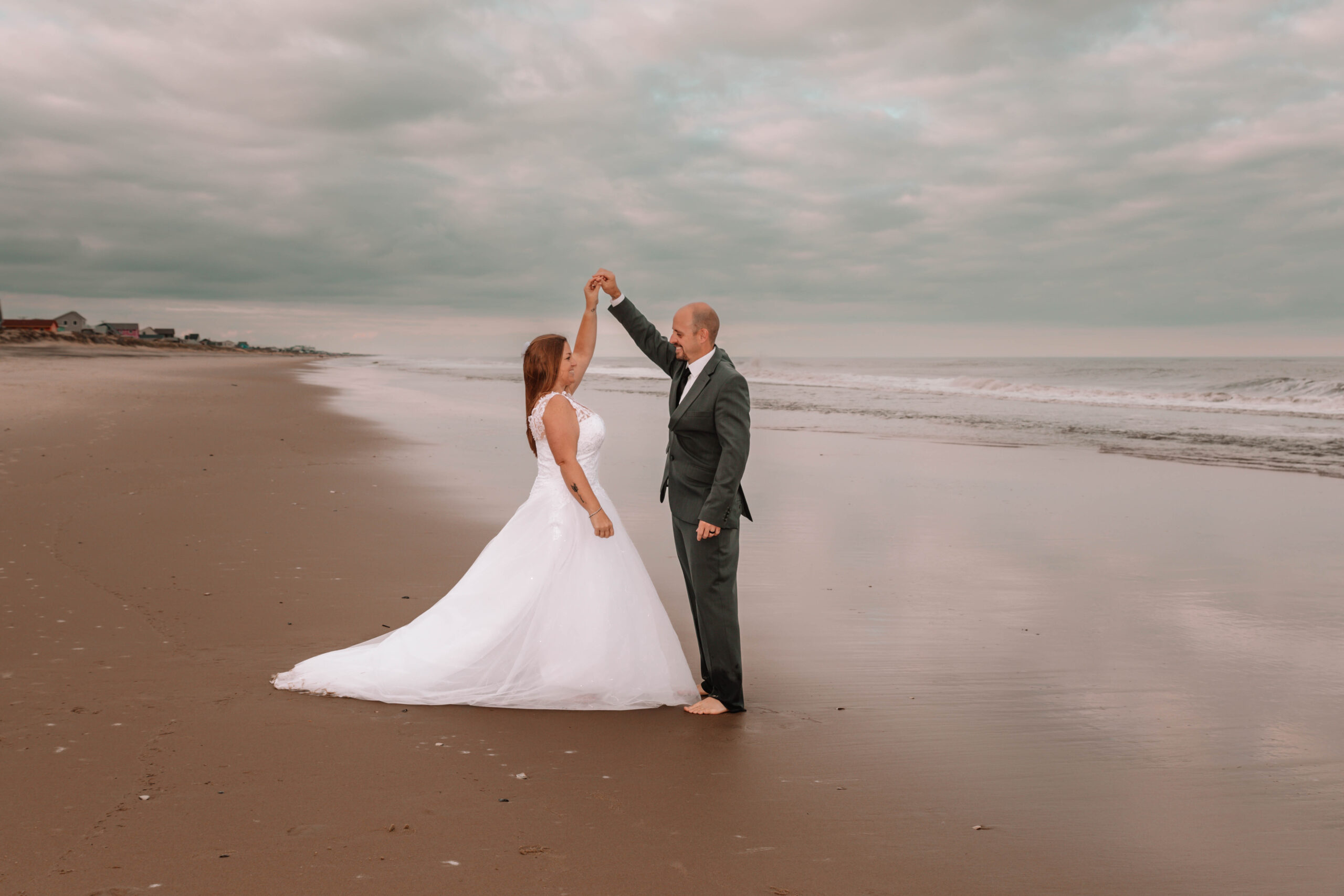 wedding dress man and woman on beach obx kitty hawk