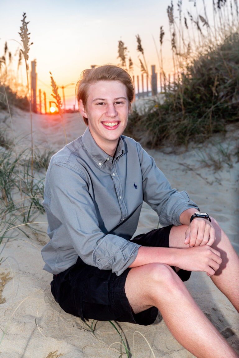 obx family beach photography and weddings mary ks photography obxhigh school senior boy sitting on beach in nags head obx outer banks mary ks photography obx